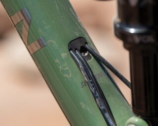 Detail image of the Rift Zone 27.5 dropper post routing from the downtube to the seattube