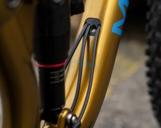 Detail image showing the dropper post cable routing, from the downtube to the seatube