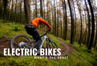 Man rides electric bike through forest